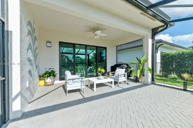 a living room with furniture and garden