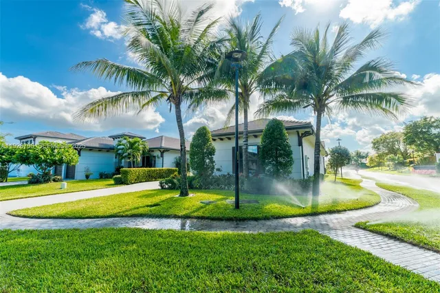a view of a backyard with swimming pool