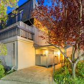 a view of entryway with a floor to ceiling window and potted plants