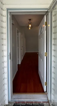 a view of gallery with wooden floor