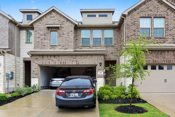 a car parked in front of a house