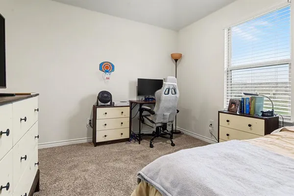 a view of a workspace with furniture