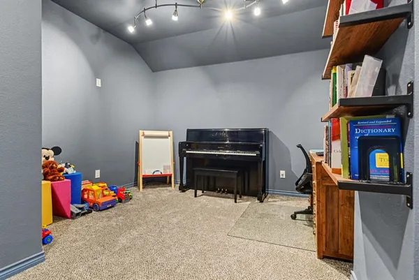 a bedroom with a bed and a television