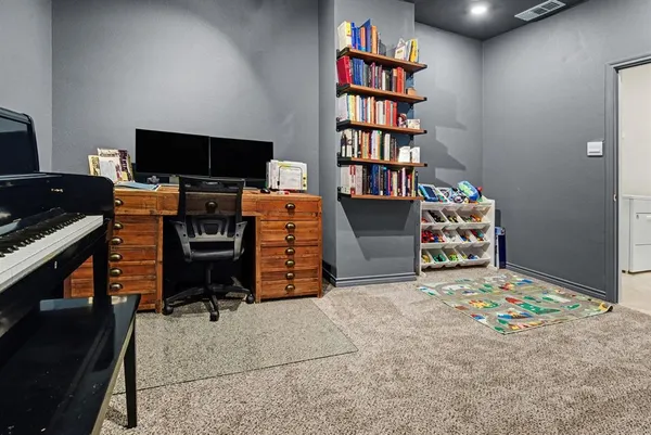 a view of a workspace with furniture