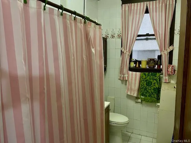 a bathroom with a sink and toilet