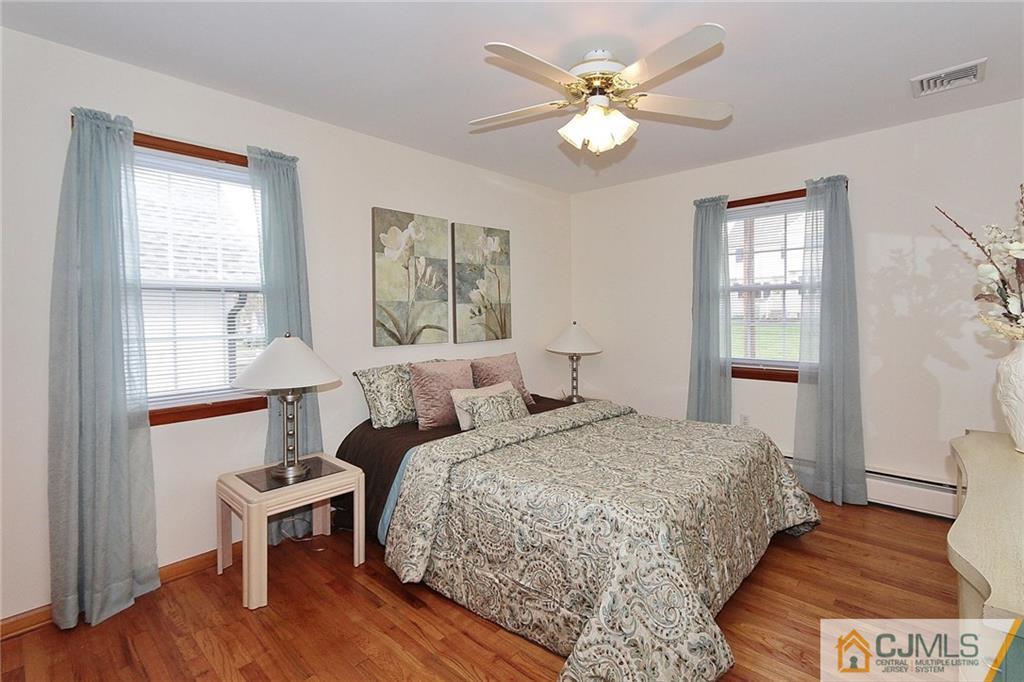 93 Morningside Road Colonia, NJ 07067 - Photo 14 of 23 a bedroom with a bed and a window
