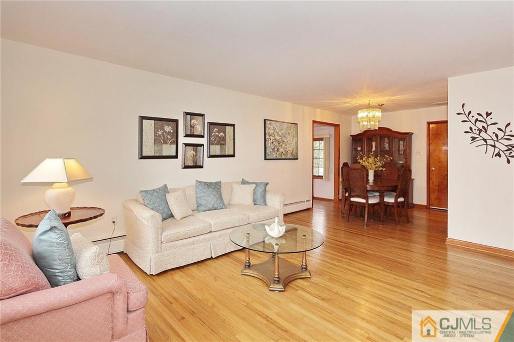 93 Morningside Road Colonia, NJ 07067 - Photo 3 of 23 a living room with furniture and wooden floor