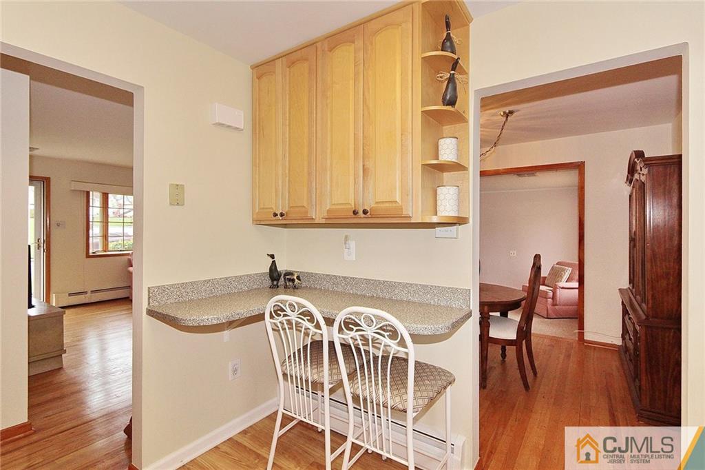 93 Morningside Road Colonia, NJ 07067 - Photo 10 of 23 a view of a dining room with furniture and wooden floor