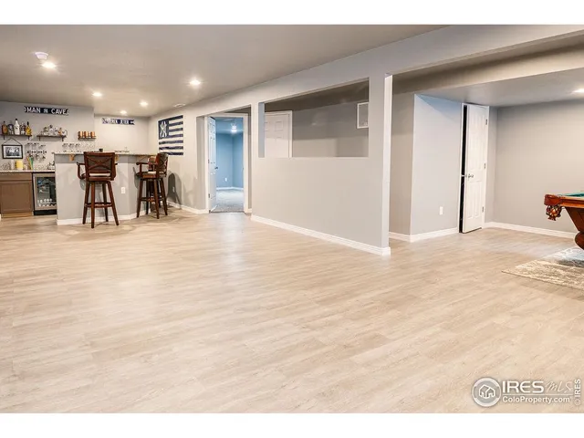 a view of an empty room with kitchen