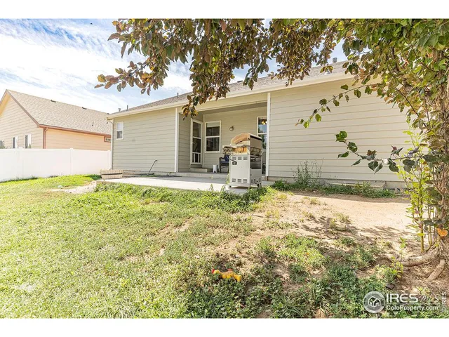 a backyard of a house with yard and garage