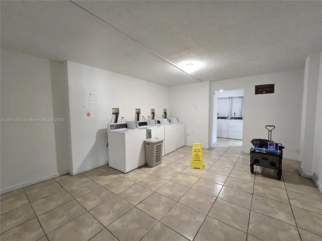 a view of kitchen with furniture and flat screen tv