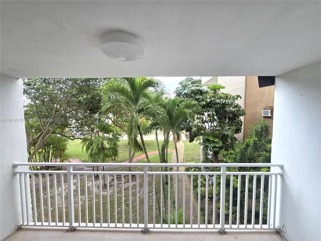 a view of balcony with wooden floor