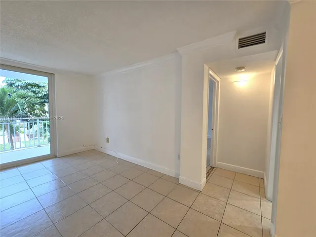 a view of an empty room and window