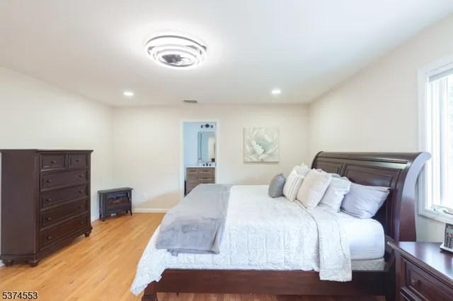 a bedroom with a bed and a cabinets