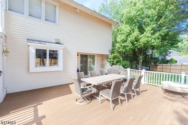 a view of a patio with a table and chairs