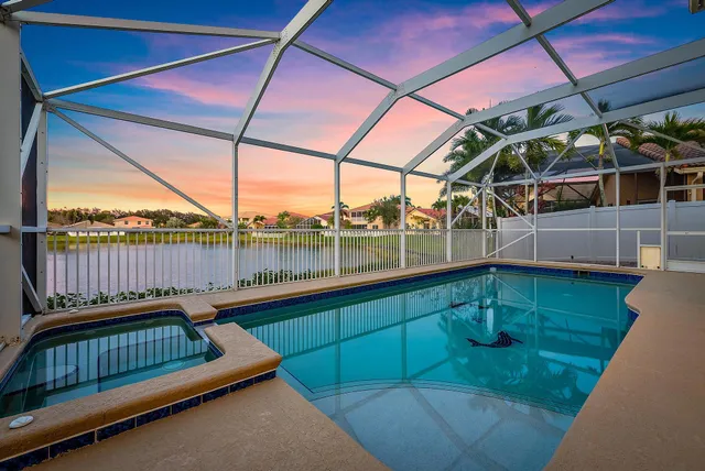 a view of a deck with a table and chairs under an umbrella