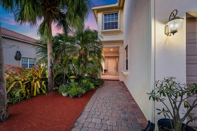 a kitchen with stainless steel appliances granite countertop a stove top oven a sink dishwasher and a refrigerator