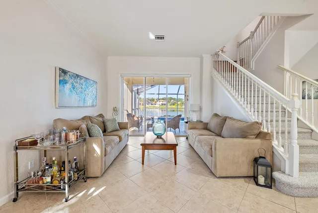 a view of a dining room with furniture and a window