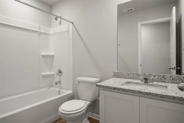 a bathroom with a granite countertop sink mirror and double