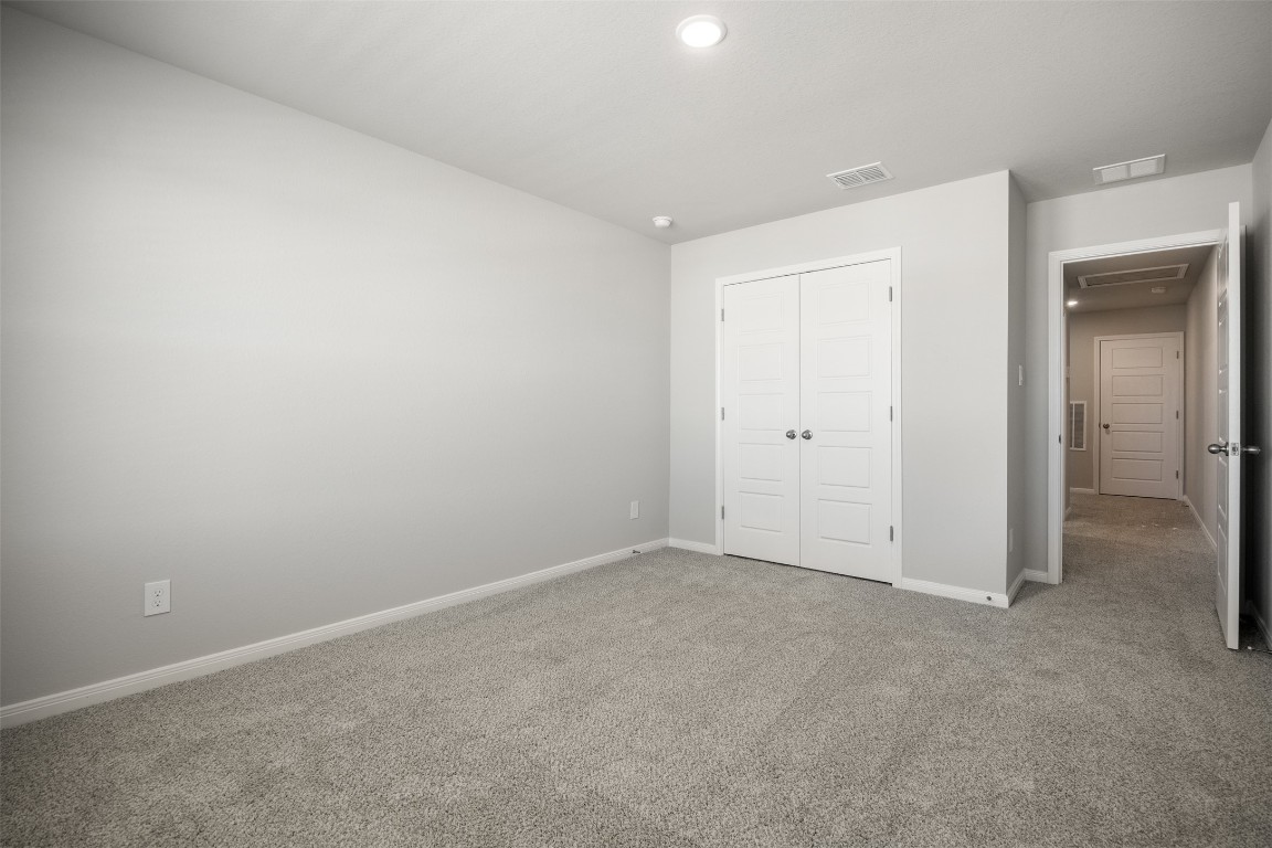 445 Cross Barn Boulevard, Unit B Buda, TX 78610 - Photo 13 of 18 a view of an empty room