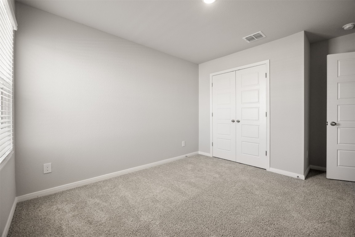 445 Cross Barn Boulevard, Unit B Buda, TX 78610 - Photo 14 of 18 a view of an empty room