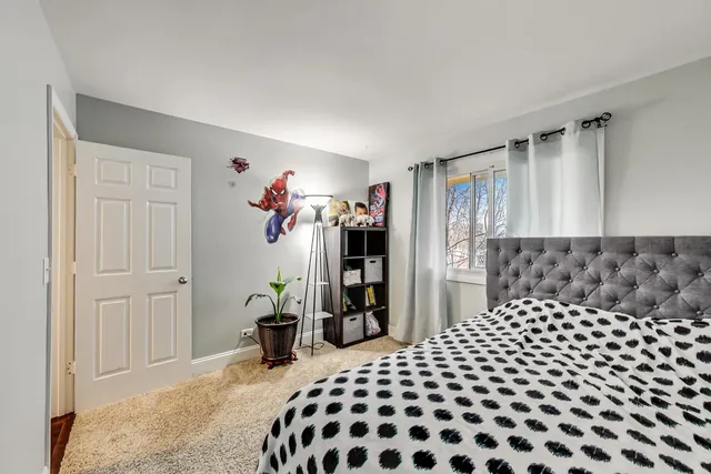 a bedroom with a bed and a closet