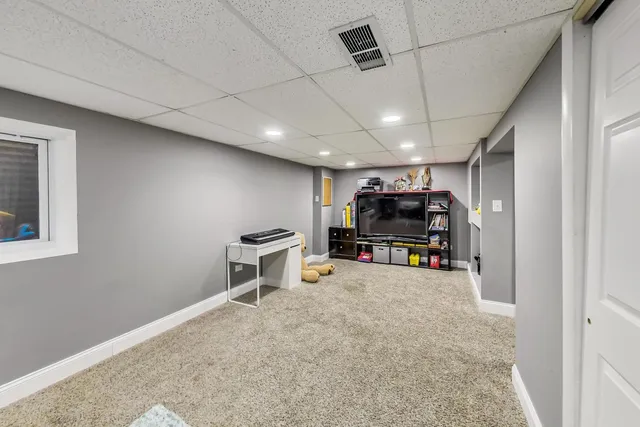 a view of a room with furniture and a window