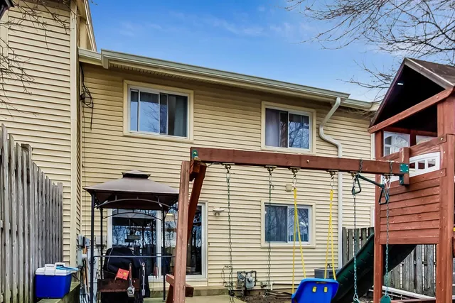 a view of the house and a back yard