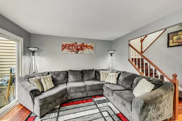 a living room with furniture and a rug