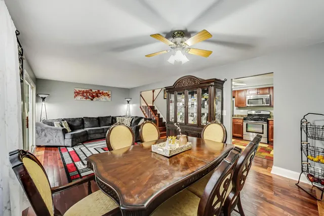 a view of a dining room with furniture and wooden floor