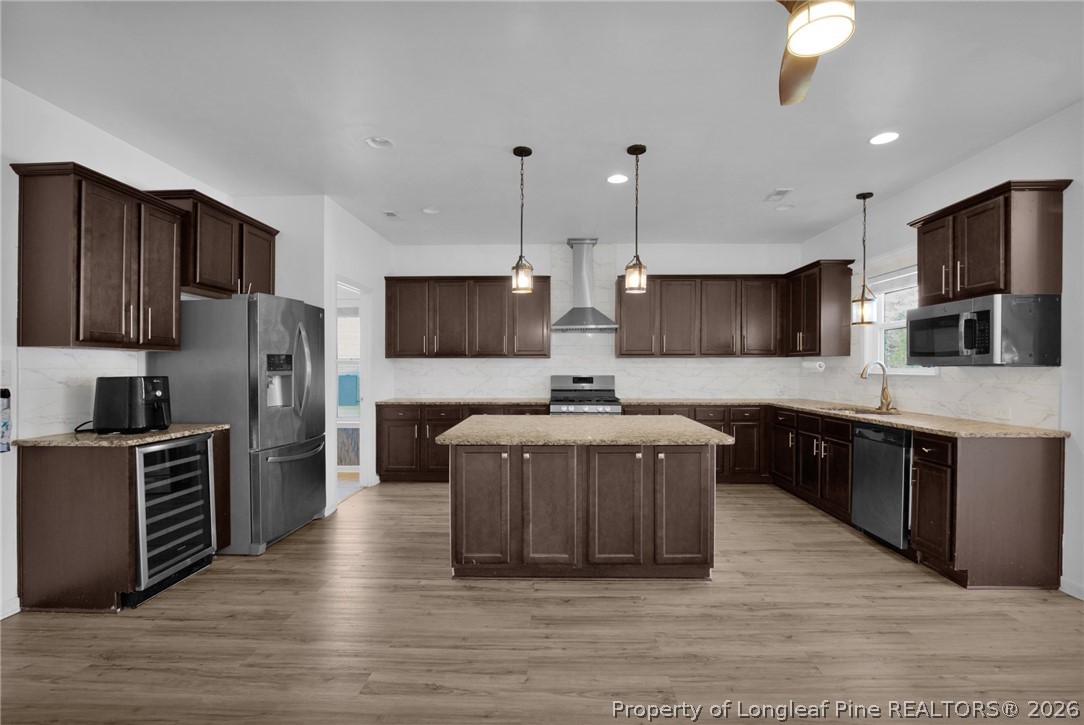 2145 Harrington Road Fayetteville, NC 28306 - Photo 17 of 50 a large kitchen with a large counter top stainless steel appliances and cabinets