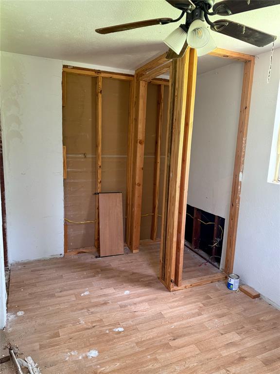 116 5th Street Whitney, TX 76692 - Photo 20 of 23 a view of a room with wooden floor and a fireplace
