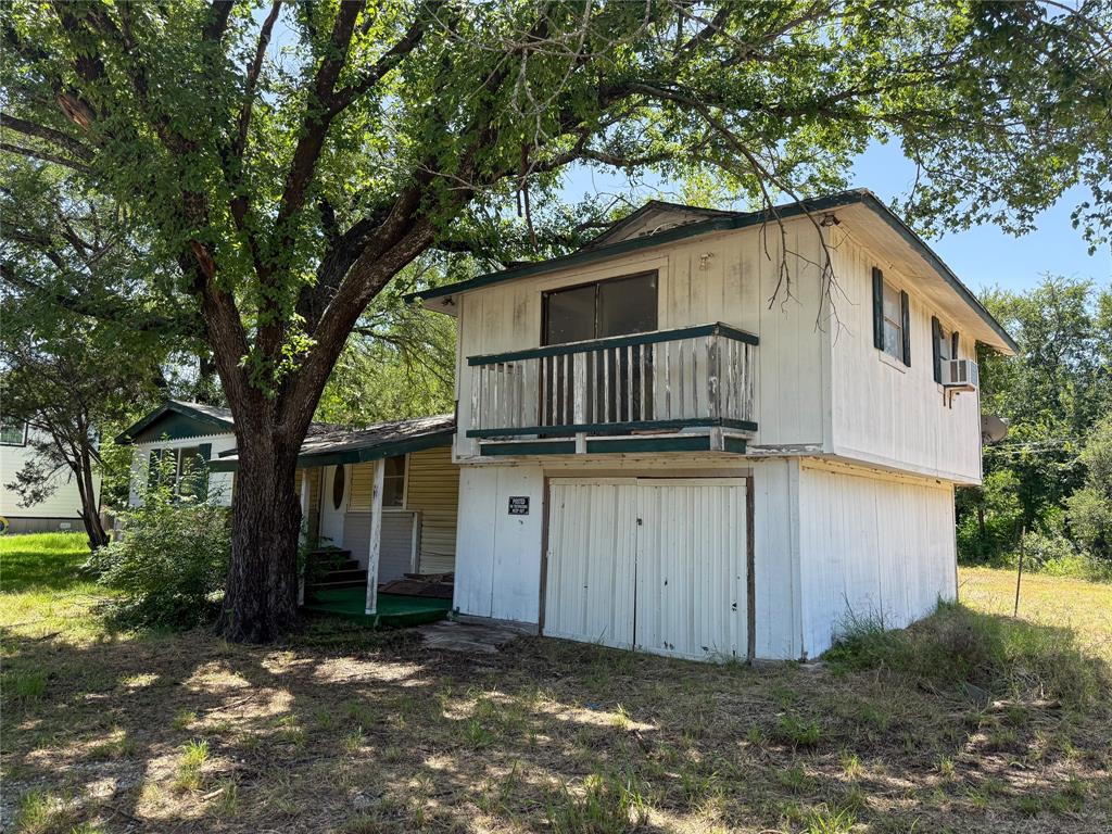 116 5th Street Whitney, TX 76692 - Photo 2 of 23 a house view with a outdoor space