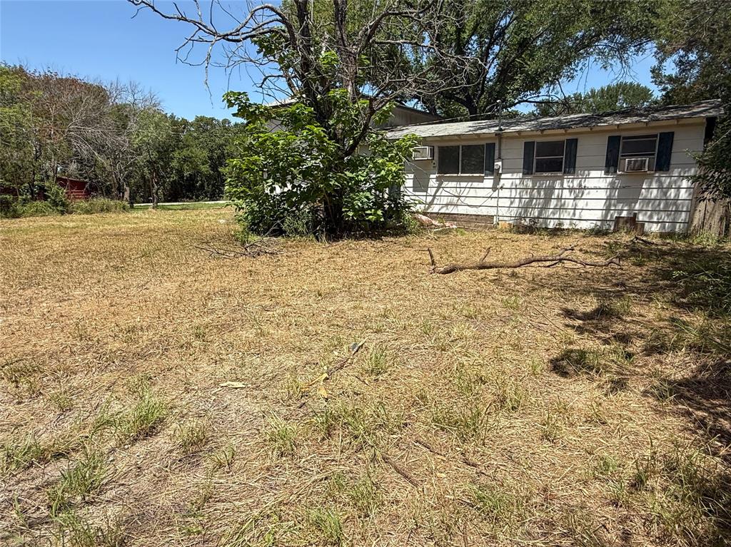 116 5th Street Whitney, TX 76692 - Photo 21 of 23 a view of a backyard of the house