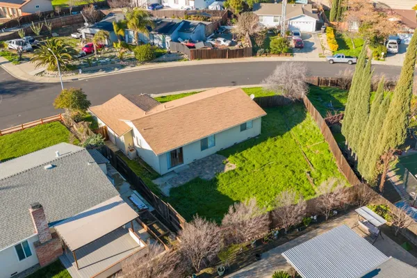 an aerial view of a house with a swimming pool