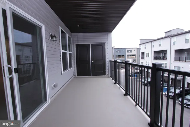a kitchen with stainless steel appliances granite countertop a sink a stove and a wooden floors