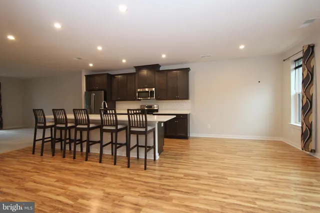 a view of empty room with ceiling fan