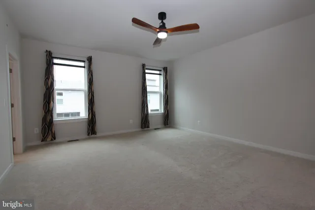 a bathroom with a shower and a sink