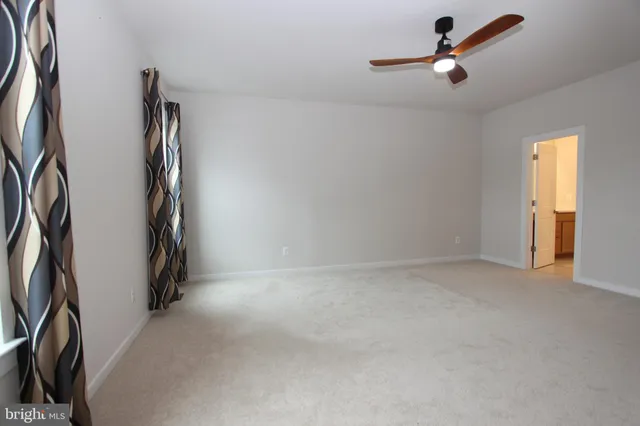 a bathroom with a shower and a sink