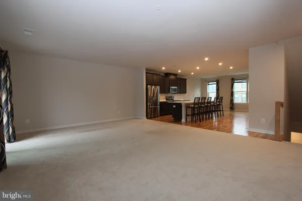a view of kitchen with furniture and floor to ceiling window
