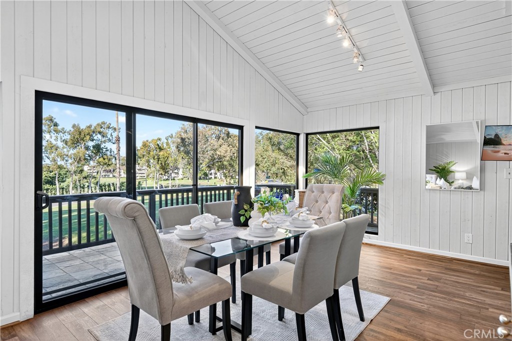30 Nuevo, Unit 15 Irvine, CA 92612 - Photo 16 of 69 a dining room with furniture window and wooden floor
