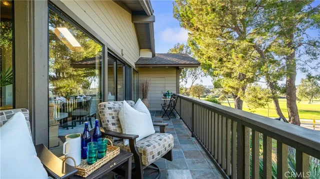 a kitchen with stainless steel appliances granite countertop a refrigerator a oven a sink and dishwasher with wooden floor