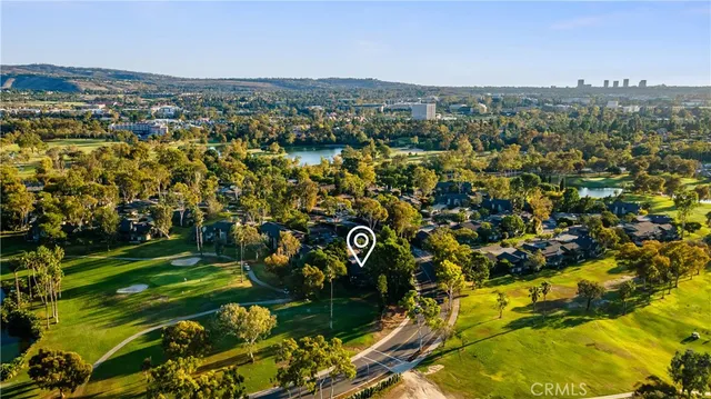 a kitchen with stainless steel appliances wooden floors and wooden cabinets