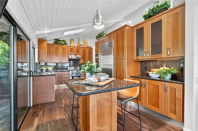a dining room with furniture window and wooden floor