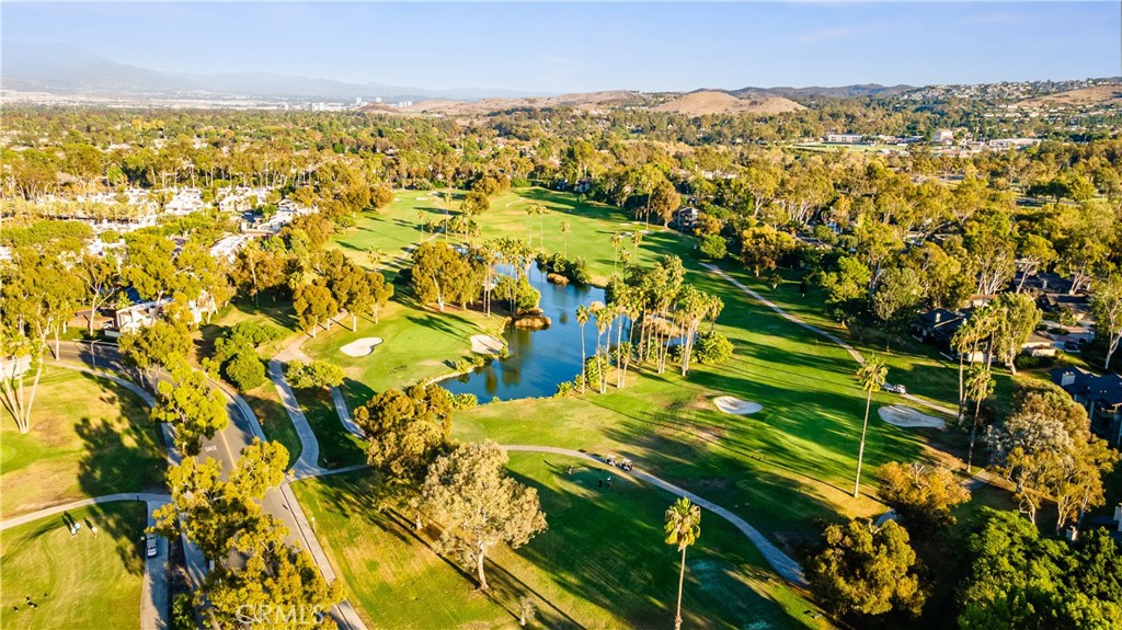 30 Nuevo, Unit 15 Irvine, CA 92612 - Photo 29 of 69 an aerial view of residential houses with outdoor space and trees