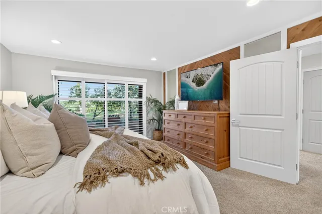a bathroom with a granite countertop sink a toilet a mirror and shower