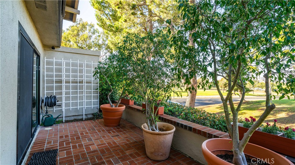 30 Nuevo, Unit 15 Irvine, CA 92612 - Photo 36 of 69 a view of a porch with backyard of the house