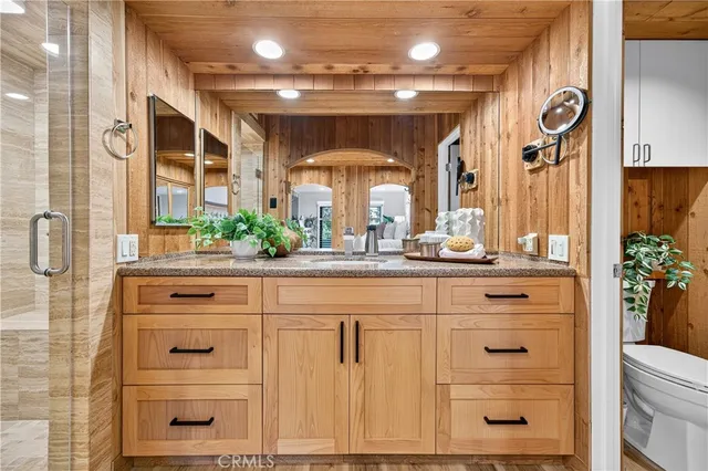 a view of bedroom and bedroom with wooden floor