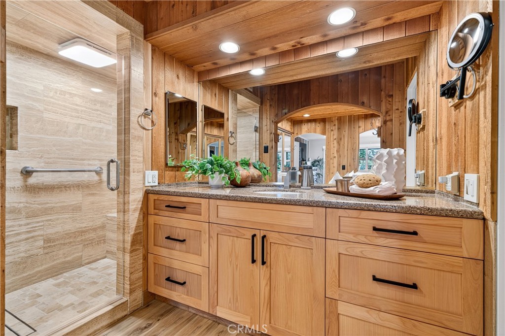 30 Nuevo, Unit 15 Irvine, CA 92612 - Photo 41 of 69 a bathroom with a sink a mirror and shower