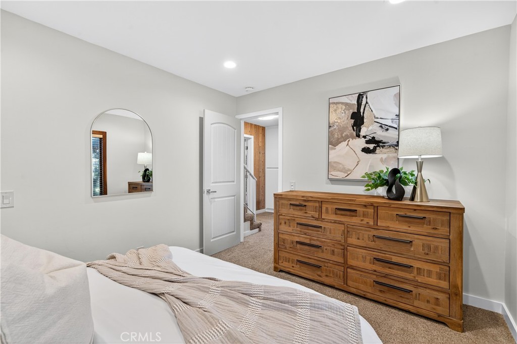 30 Nuevo, Unit 15 Irvine, CA 92612 - Photo 49 of 69 a bedroom with a bed and a dresser